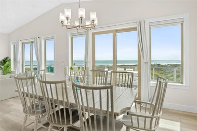 This LUXURIOUS BEACHFRONT smart home has it ALL! Three stories