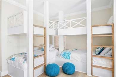 This LUXURIOUS BEACHFRONT smart home has it ALL! Three stories