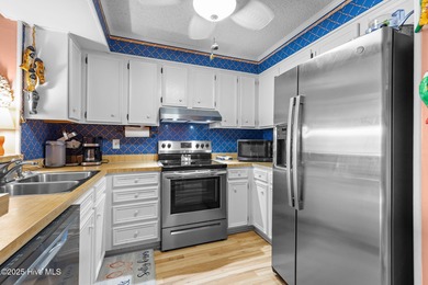 Enjoy island life with this oceanside 3 bedroom 2 1/2 bath condo