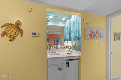 Enjoy island life with this oceanside 3 bedroom 2 1/2 bath condo