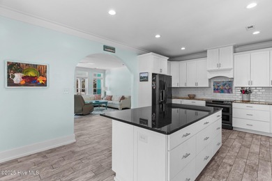 PRICED WELL BELOW APPRAISED VALUE! WELCOME TO COASTAL LUXURY AT