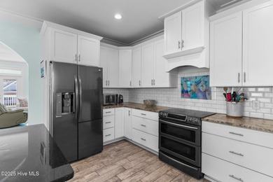 PRICED WELL BELOW APPRAISED VALUE! WELCOME TO COASTAL LUXURY AT