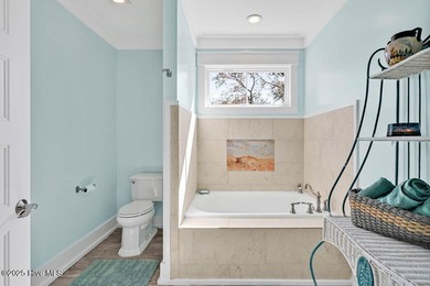 PRICED WELL BELOW APPRAISED VALUE! WELCOME TO COASTAL LUXURY AT