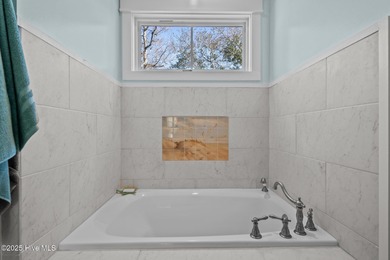 PRICED WELL BELOW APPRAISED VALUE! WELCOME TO COASTAL LUXURY AT