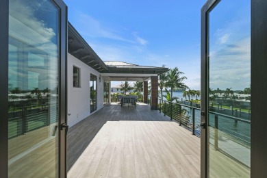 Experience the ultimate in coastal living with this custom-built