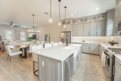 This exquisite four-bedroom, three-and one-half bath luxury