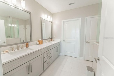 This exquisite four-bedroom, three-and one-half bath luxury