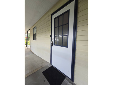 Welcome to this beautifully maintained 1990 double-wide