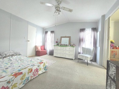 Welcome to this beautifully maintained 1990 double-wide