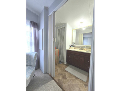 Welcome to this beautifully maintained 1990 double-wide