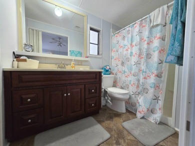 Welcome to this beautifully maintained 1990 double-wide