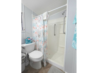 Welcome to this beautifully maintained 1990 double-wide