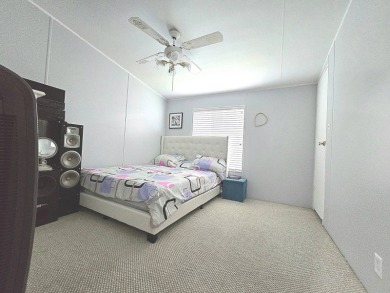 Welcome to this beautifully maintained 1990 double-wide