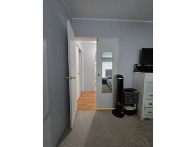 Welcome to this beautifully maintained 1990 double-wide