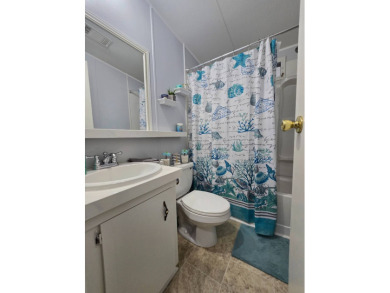 Welcome to this beautifully maintained 1990 double-wide