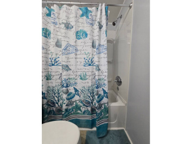 Welcome to this beautifully maintained 1990 double-wide