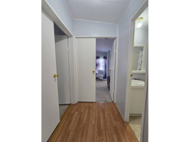 Welcome to this beautifully maintained 1990 double-wide