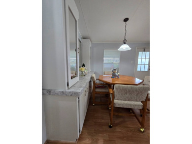 Welcome to this beautifully maintained 1990 double-wide