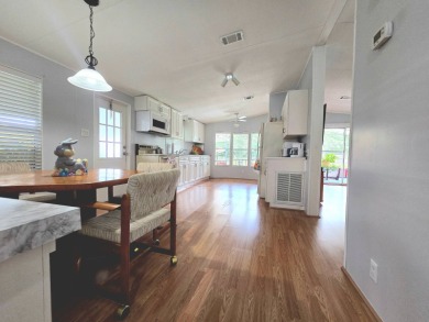 Welcome to this beautifully maintained 1990 double-wide