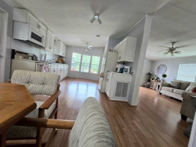 Welcome to this beautifully maintained 1990 double-wide