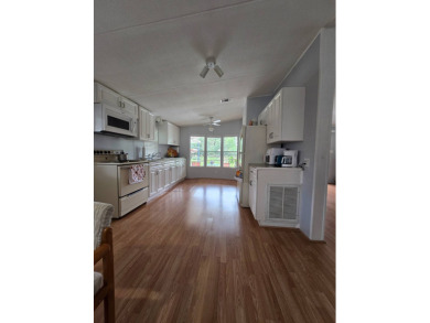 Welcome to this beautifully maintained 1990 double-wide