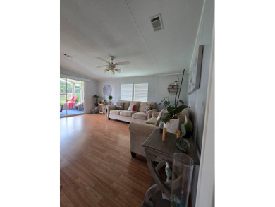 Welcome to this beautifully maintained 1990 double-wide