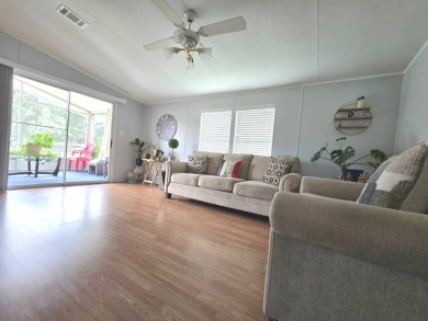 Welcome to this beautifully maintained 1990 double-wide