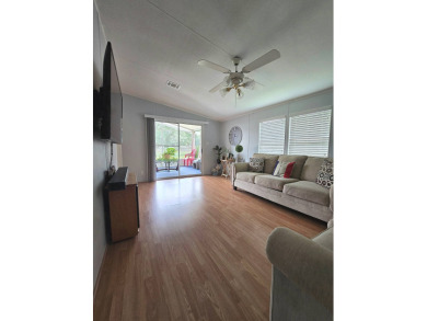 Welcome to this beautifully maintained 1990 double-wide