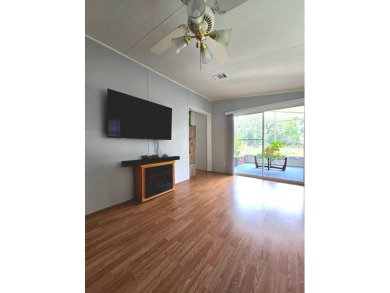 Welcome to this beautifully maintained 1990 double-wide