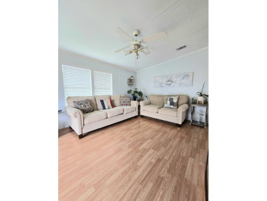 Welcome to this beautifully maintained 1990 double-wide