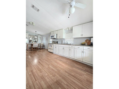 Welcome to this beautifully maintained 1990 double-wide