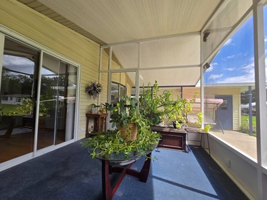 Welcome to this beautifully maintained 1990 double-wide