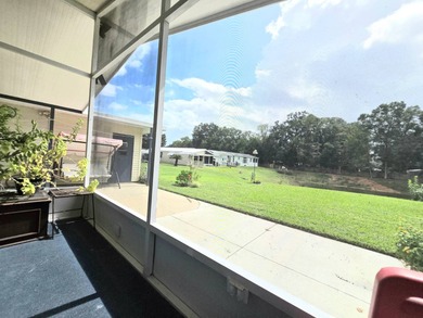 Welcome to this beautifully maintained 1990 double-wide