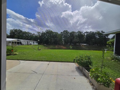 Welcome to this beautifully maintained 1990 double-wide