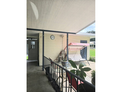 Welcome to this beautifully maintained 1990 double-wide