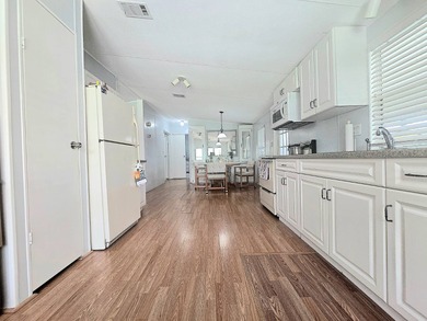 Welcome to this beautifully maintained 1990 double-wide