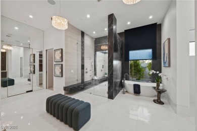 Exquisite lake view custom estate, tucked behind triple gates in