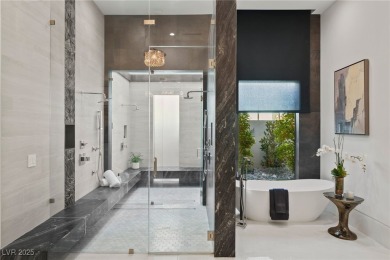 Exquisite lake view custom estate, tucked behind triple gates in