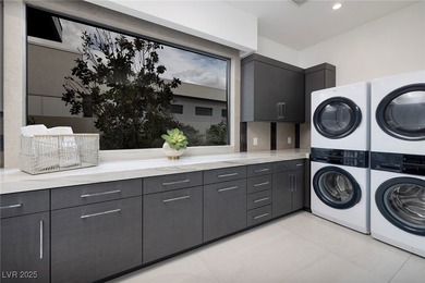 Exquisite lake view custom estate, tucked behind triple gates in