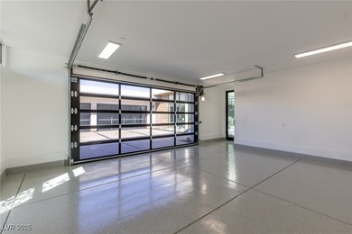 Exquisite lake view custom estate, tucked behind triple gates in