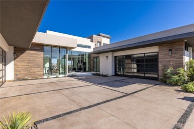 Exquisite lake view custom estate, tucked behind triple gates in