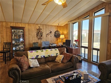 Perfectly situated on an oversized corner lot within the highly