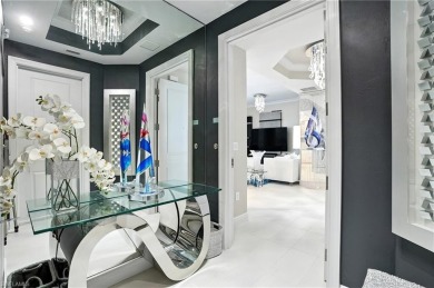 Perched at the very end of Bay Beach Lane, this exceptional