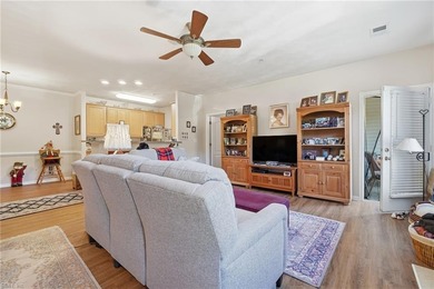 Second story condo with elevator. Covered balcony.  Large open