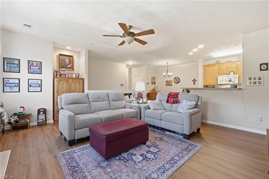 Second story condo with elevator. Covered balcony.  Large open