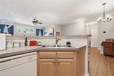 Second story condo with elevator. Covered balcony.  Large open