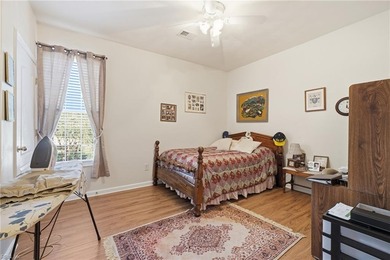 Second story condo with elevator. Covered balcony.  Large open