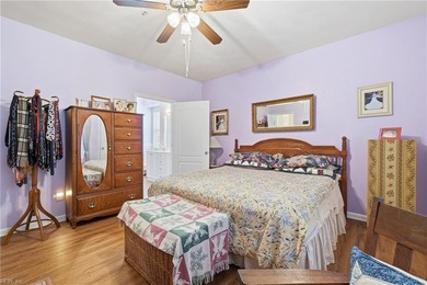 Second story condo with elevator. Covered balcony.  Large open