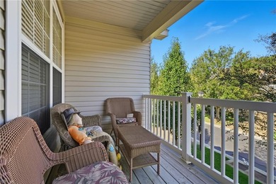 Second story condo with elevator. Covered balcony.  Large open