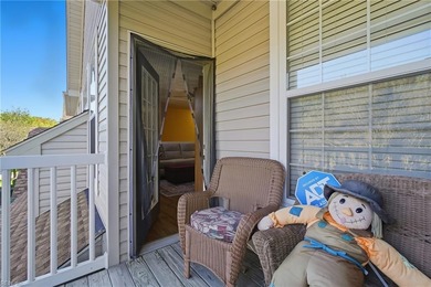 Second story condo with elevator. Covered balcony.  Large open